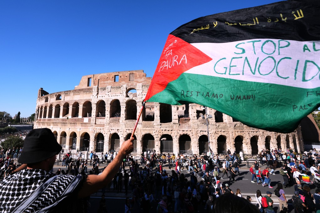 Pro-Palestinian demonstrators pass in front of Rome’s Colosseum on Saturday during a march calling for an end to the war in Gaza. Photo: AP