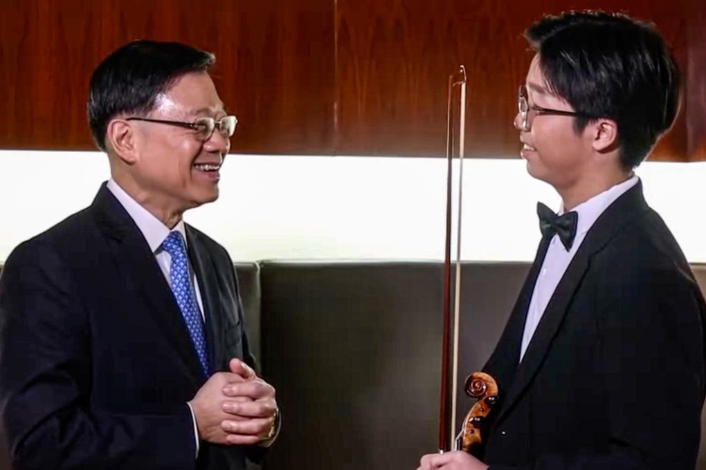 City leader John Lee meets Li Ching-po to congratulate the teenager on his success. Photo: Handout