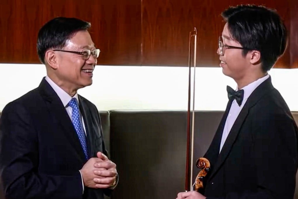 City leader John Lee meets Li Ching-po to congratulate the teenager on his success. Photo: Handout