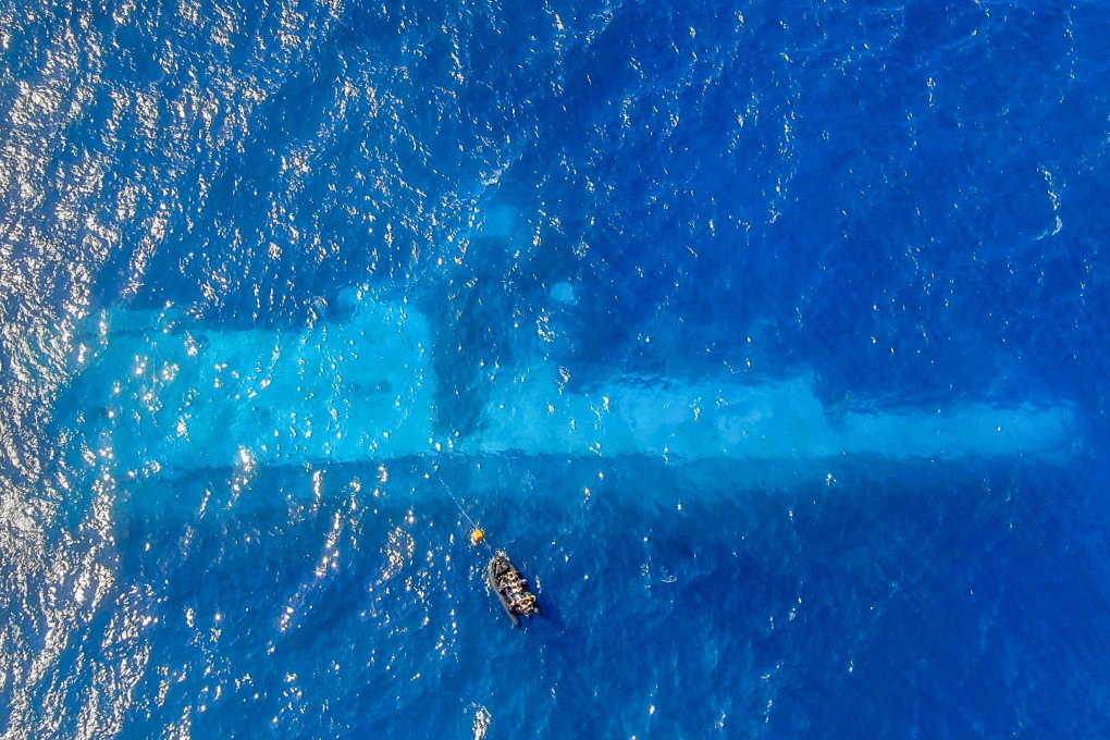 Divers survey the area around the sunken HMNZS Manawanui off Upulo, Samoa on October 15, last year. Photo: New Zealand Defence Force/AP)