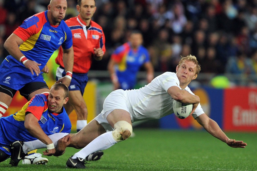 England flanker Lewis Moody (right) is tackled by Romanian fly-half Marin Dumbrava during their 2011 Rugby World Cup match in Dunedin, New Zealand. Photo: AFP