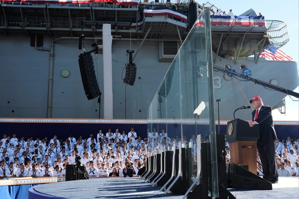 US President Donald Trump speaking behind bulletproof glass aboard the USS Harry S. Truman at Naval Station Norfolk. Photo: AP