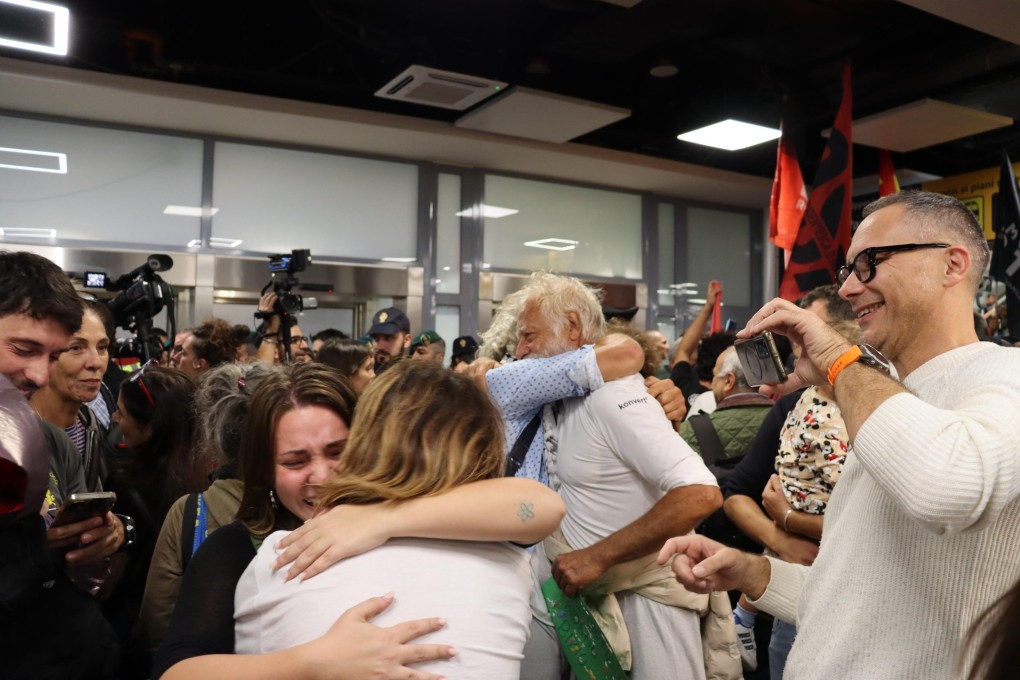 Global Sumud Flotilla activists are welcomed after arriving at Fiumicino Airport on a Turkish Airlines flight in Rome on Saturday. Many activists remain in prison. Photo:  EPA / Telenews