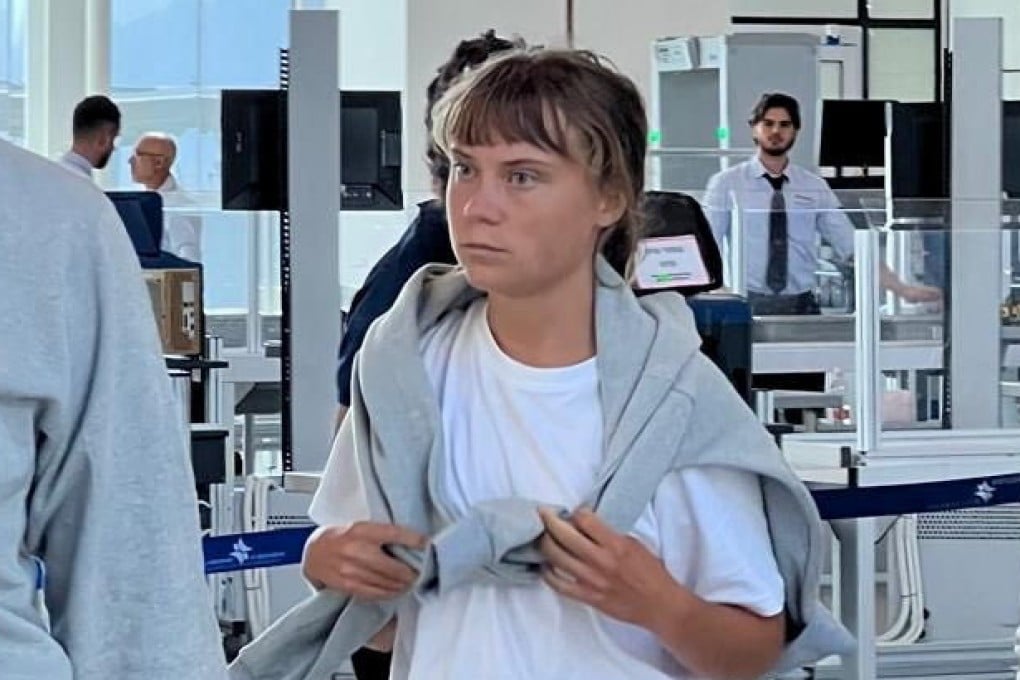 Swedish activist Greta Thunberg, centre, before her deportation at an Israeli airport. Photo: Israel Foreign Ministry / Reuters