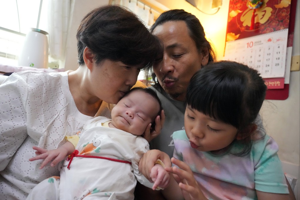 Lilian Chan Lai-lai, left, with her husband, Brian Wong Chak-fung, and their two daughters at their home in Tuen Mun on September 30. Photo: May Tse