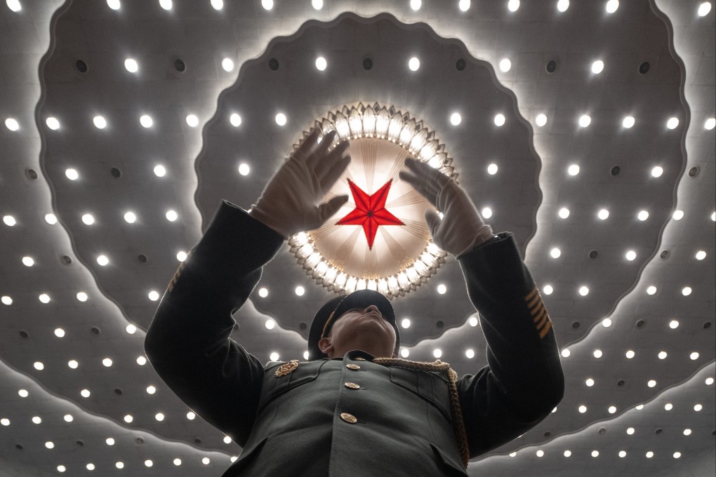 A Chinese military band conductor in action at the closing ceremony of the National People’s Congress, in Beijing on March 11. Several senior members of the military have been ensnared in the anti-corruption drive spearheaded by President Xi Jinping. Photo: AP