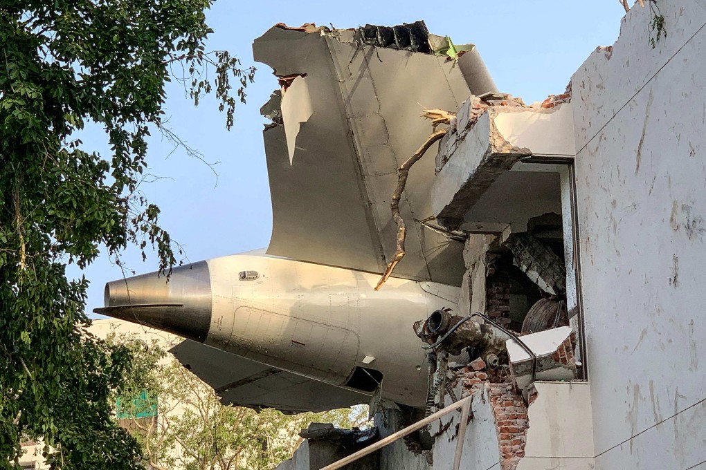 The tail of Air India flight 171 is pictured after it crashed in a residential area near the airport in Ahmedabad on June 12. Photo: AFP