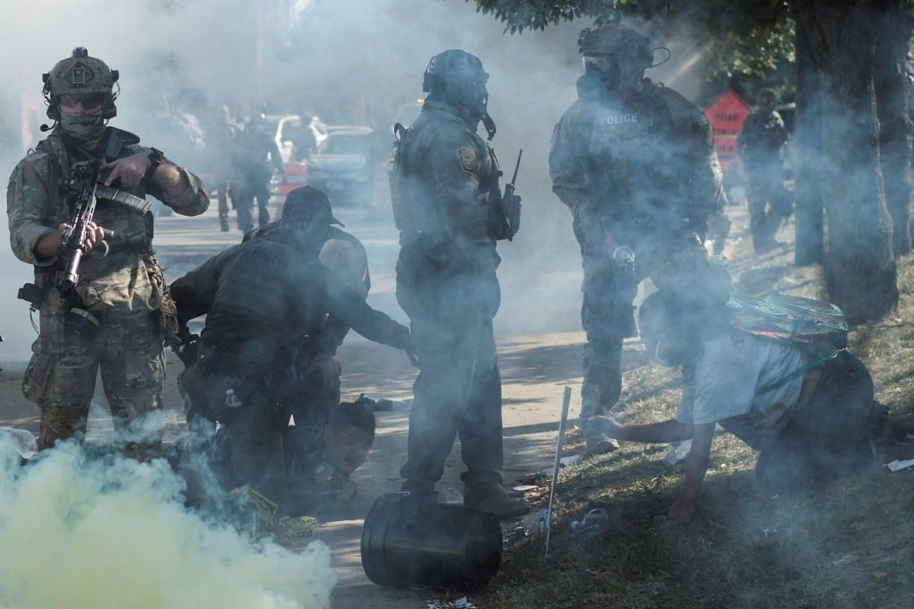 Tear gas rises during a standoff with US Immigration and Customs Enforcement (ICE) and federal officers in the Little Village neighbourhood of Chicago, Illinois, on Saturday. Photo: Reuters
