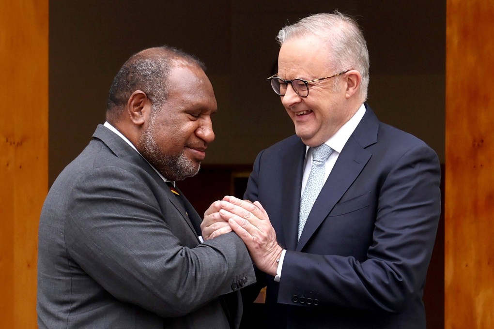 Australia’s Prime Minister Anthony Albanese (right) greets Papua New Guinea’s Prime Minister James Marape before a signing ceremony at Parliament House in Canberra on Monday. Photo: AFP