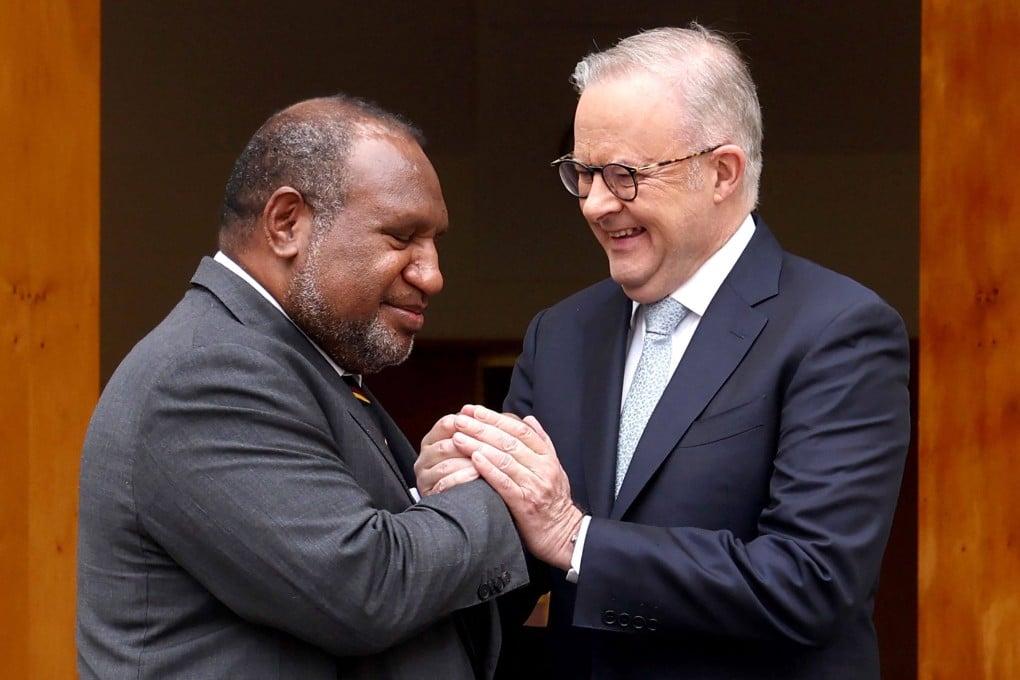 Australia’s Prime Minister Anthony Albanese (right) greets Papua New Guinea’s Prime Minister James Marape before a signing ceremony at Parliament House in Canberra on Monday. Photo: AFP