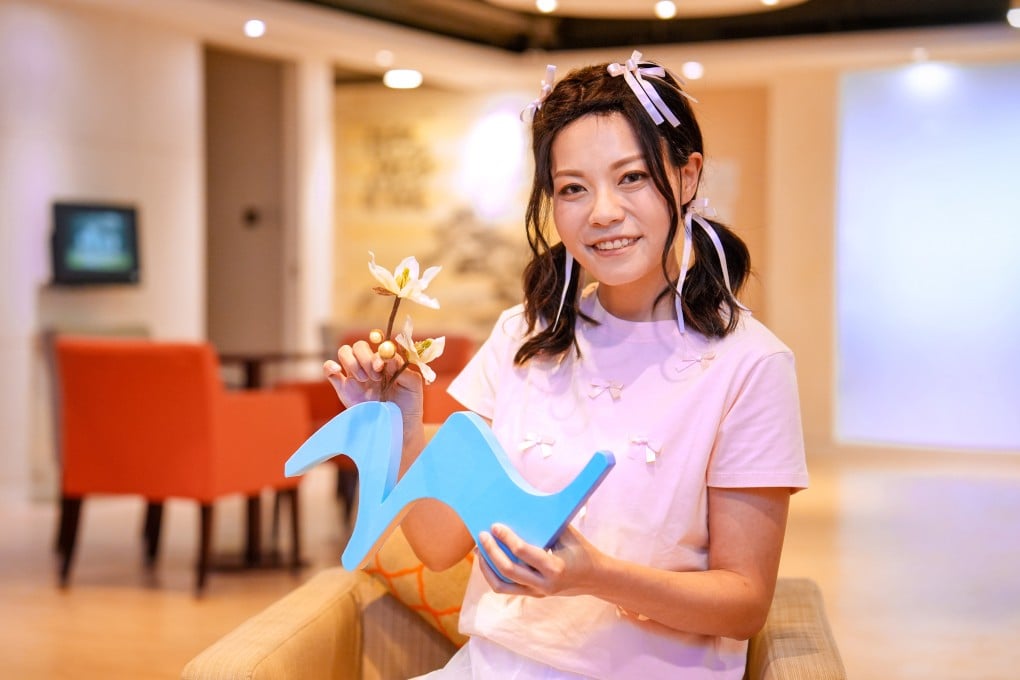 May Yeung poses with her artwork at Cancer Fund Support Centre. Photo: Elson Li