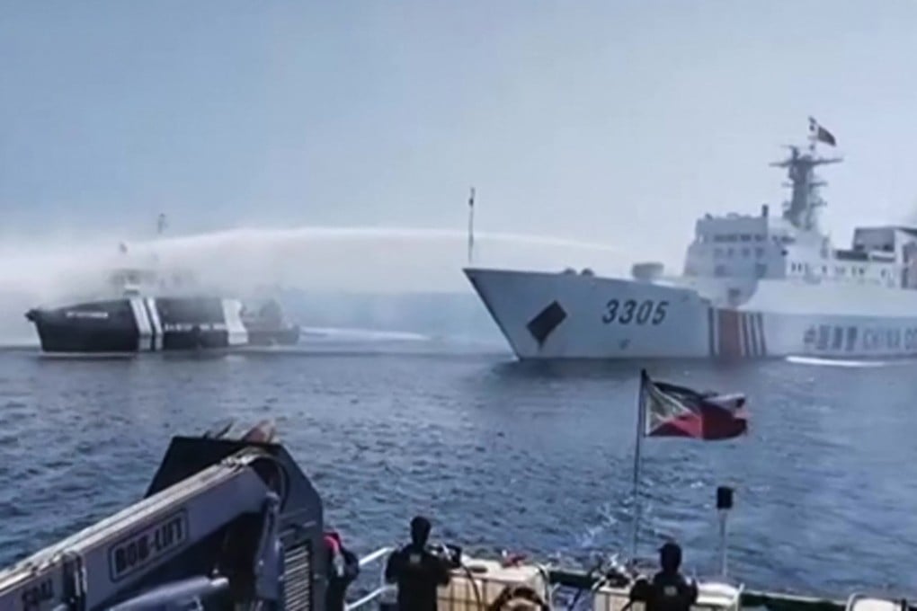 A Chinese Coast Guard ship uses a water cannon on a Philippine Bureau of Fisheries and Aquatic Resources vessel near Scarborough Shoal in the disputed South China Sea. Photo: AFP