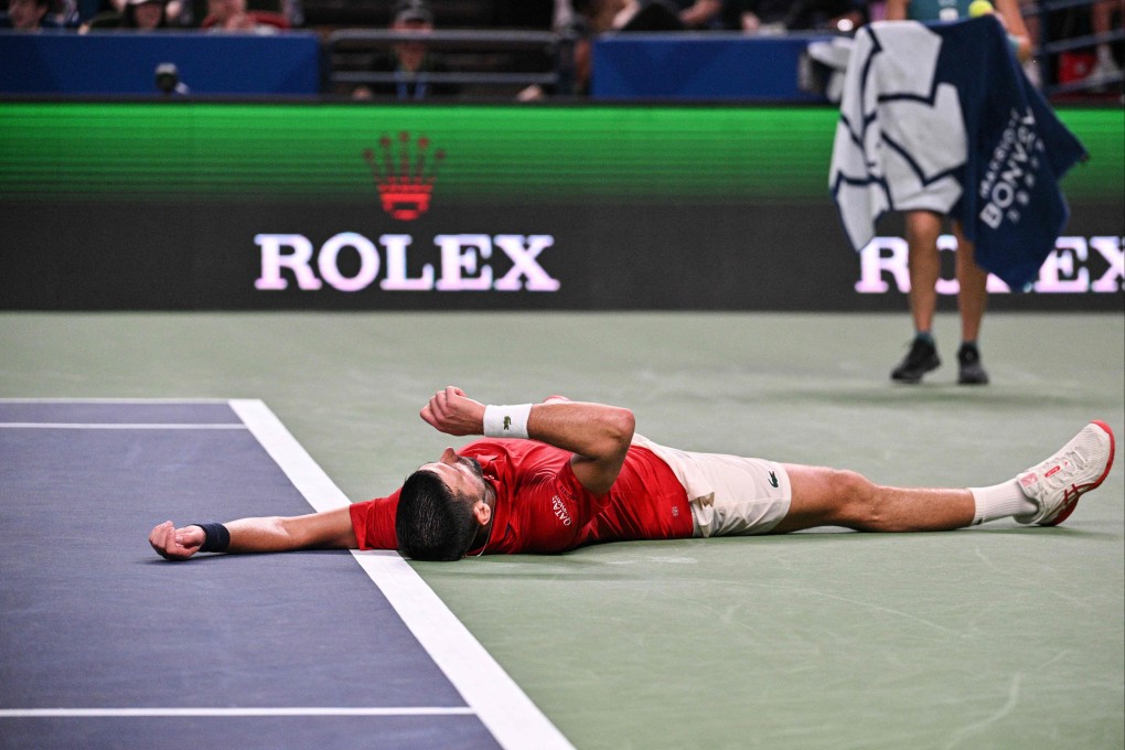 Novak Djokovic collapses during his match against Jaume Munar at the Shanghai Masters on Tuesday. Photo: AFP