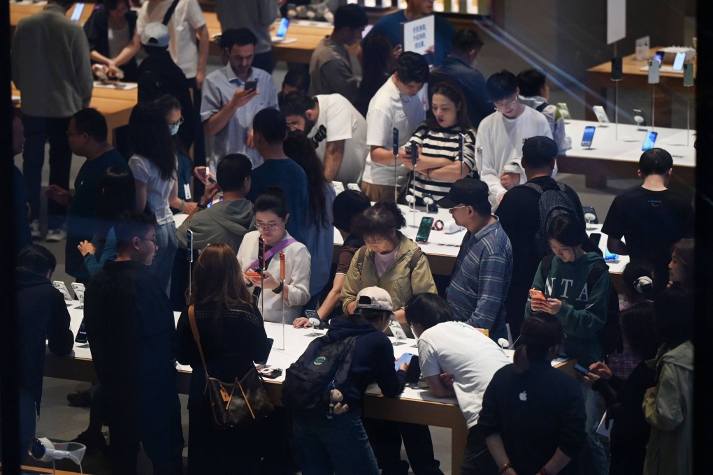 People visit an Apple store in Beijing on Tuesday during China’s National Day “golden week’ holiday. Photo: AFP