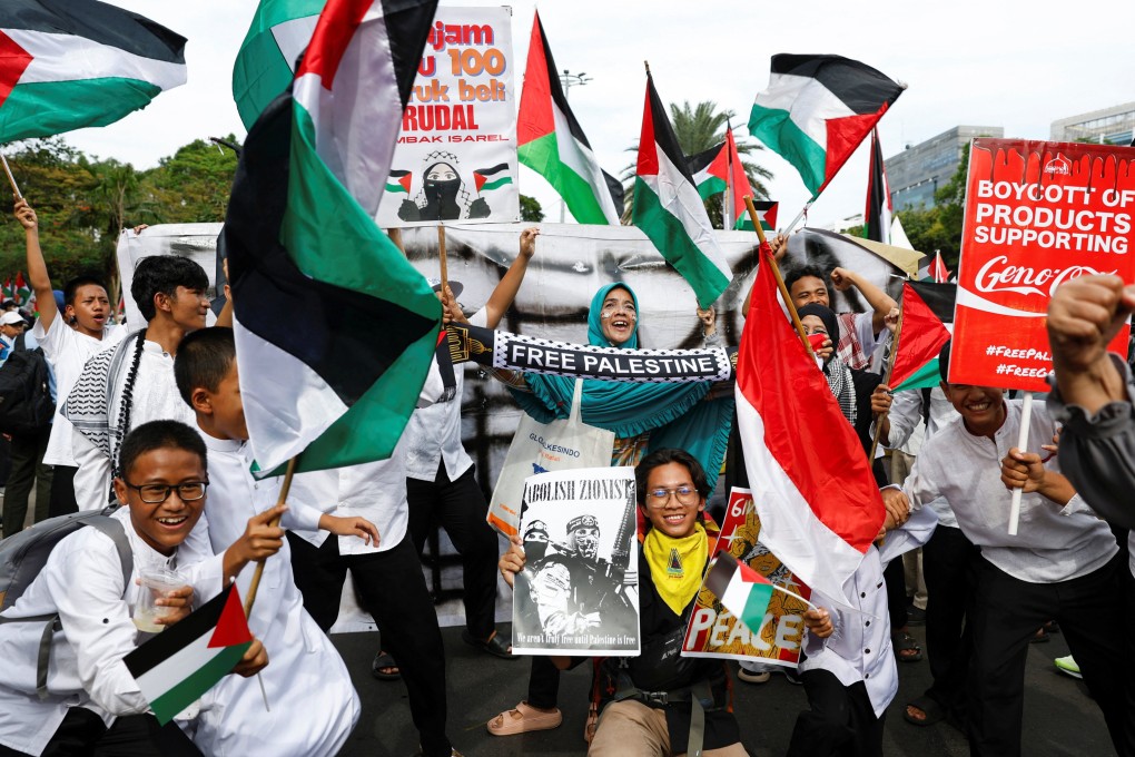 People take part in a protest in solidarity with Palestinians in Gaza on the second anniversary of the war, outside the US embassy in Jakarta, Indonesia, on Tuesday. Photo: Reuters