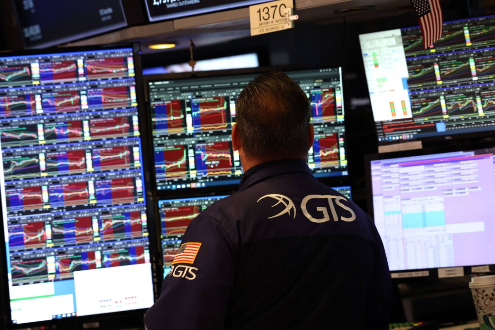 A trader works at his desk on the floor of the New York Stock Exchange on Tuesday. Photo: AFP