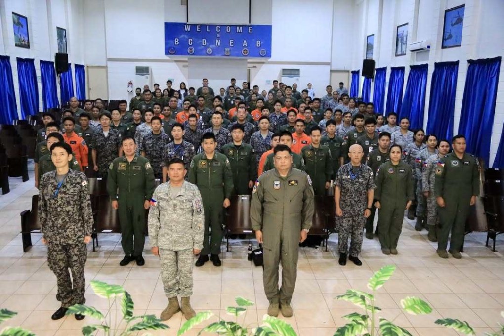 Personnel from the Philippine Air Force and the Japan Air Self-Defence Force attend a ceremony in Lapu-Lapu City on Wednesday to mark the launch of their joint mission to help quake-hit Cebu. Photo: Instagram/philairforce