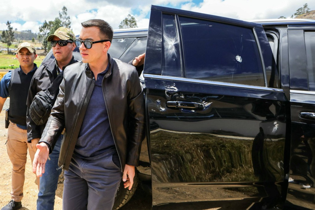 Ecuador’s President Daniel Noboa next to the vehicle that was hit by objects. Photo: Ecuadorian Presidency via AFP