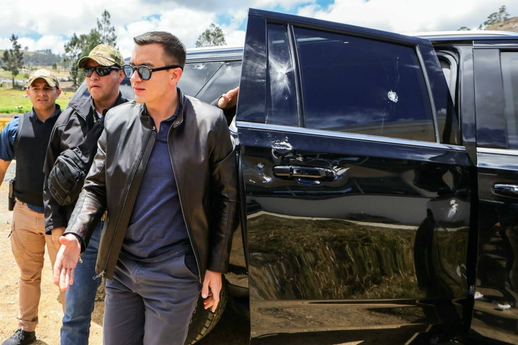 Ecuador’s President Daniel Noboa next to the vehicle that was hit by objects. Photo: Ecuadorian Presidency via AFP