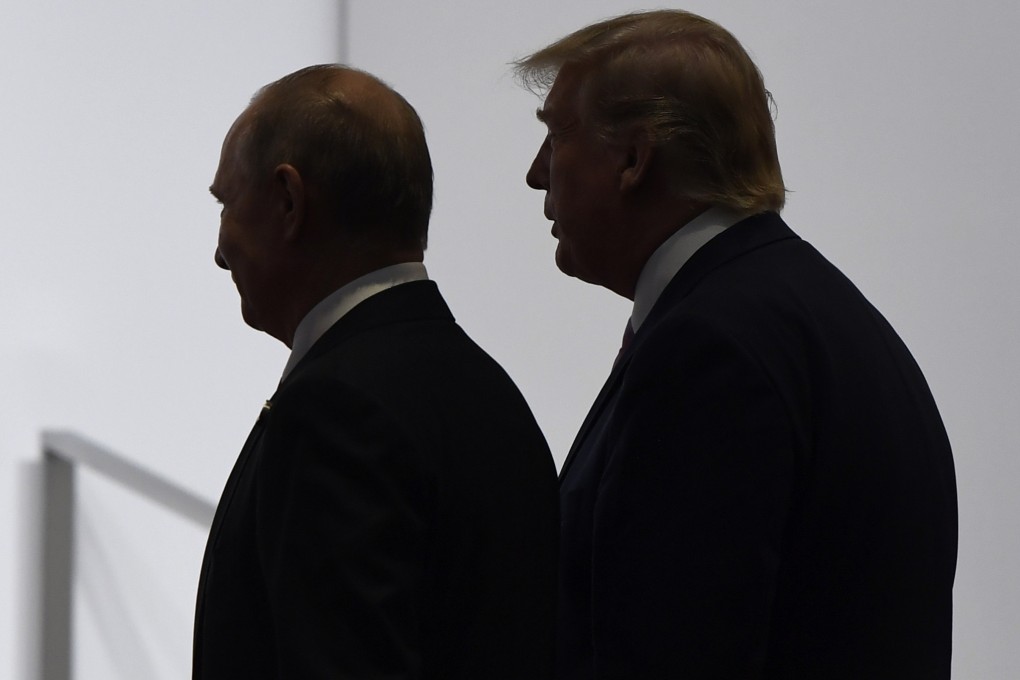 US President Donald Trump and Russian President Vladimir Putin walk together at the G20 summit in Osaka, Japan in June 2019. Photo: AP