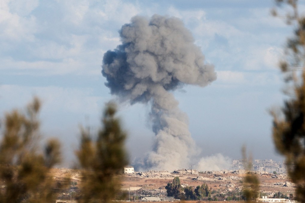 Smoke rises from an explosion in Gaza, as people attend a memorial to commemorate the two-year anniversary of the deadly October 7, 2023 attack on Israel, in Kibbutz Kfar Aza. Photo: Reuters