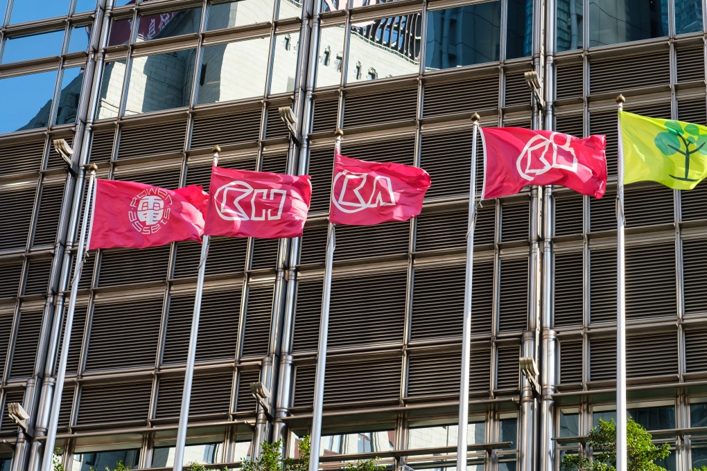 Company flags flutter outside Cheung Kong Centre. CK Life Sciences International is set to merge its subsidiary Polynoma with TransCode Therapeutics to boost its pipeline of anticancer drugs. Photo: Shutterstock