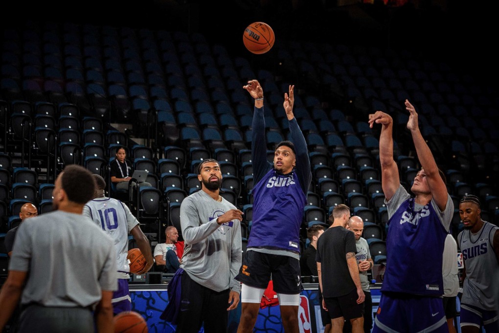 Phoenix Suns players practise shooting at the Venetian Arena in Macau on Thursday. Photo: AFP