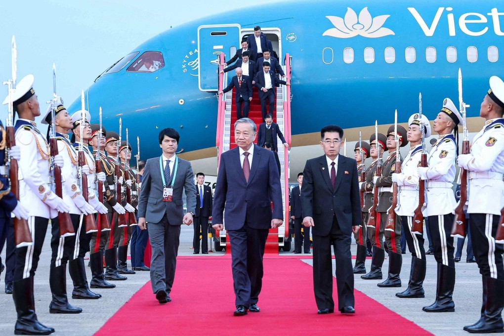 Vietnam’s Communist Party General Secretary To Lam (centre) is welcomed upon arrival at Pyongyang International Airport on Thursday. Photo: Vietnam News Agency/AFP