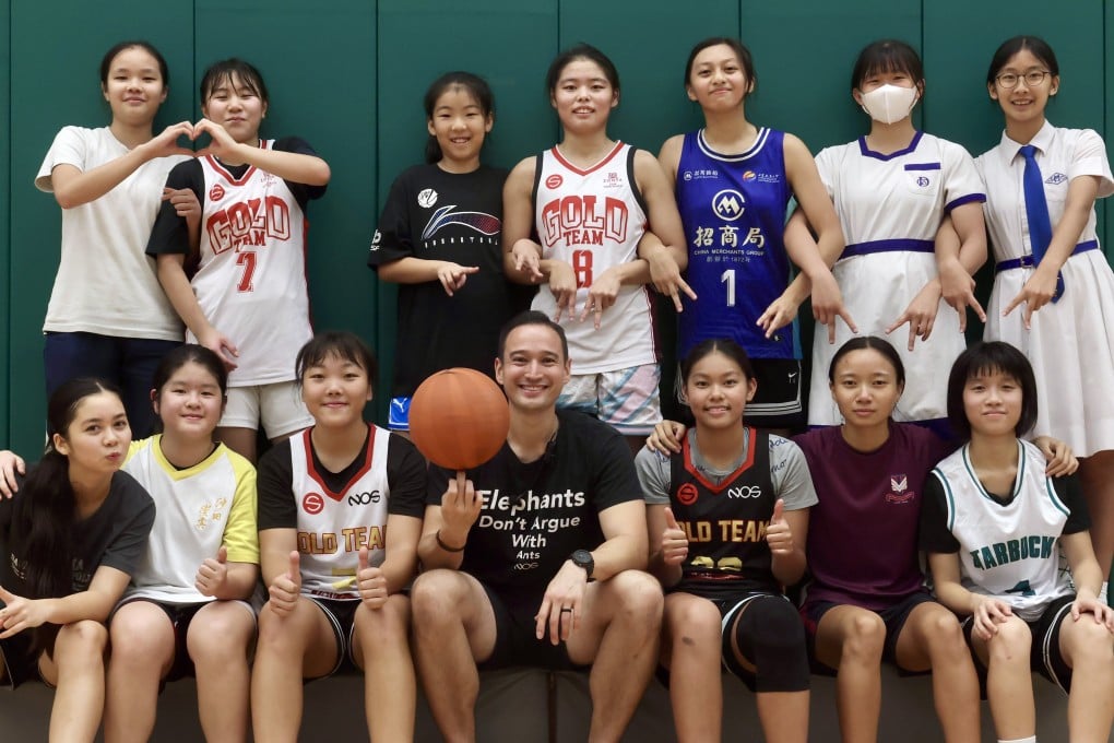 The Strive Gold Team with coach William Lo (front row, centre) pose for a photo at Boundary Street Sports Centre in Kowloon, Hong Kong. The team is the focus of a new documentary by Joanna Bowers. Photo: Jonathan Wong