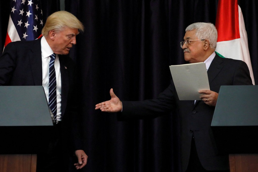 Palestinian President Mahmoud Abbas (right) extends his hand to US President Donald Trump after their meeting at the Presidential Palace in the West Bank city of Bethlehem in 2017. Photo: Reuters