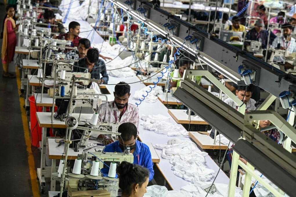 Employees work at a garment factory in Tiruppur, in the southern Indian state of Tamil Nadu on September 23. Photo: AFP
