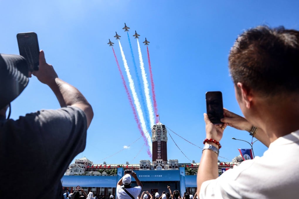 Taiwanese AT-3 advanced jet trainers perform during Double Tenth celebrations at the Presidential Palace in Taipei on Friday. Photo: AFP