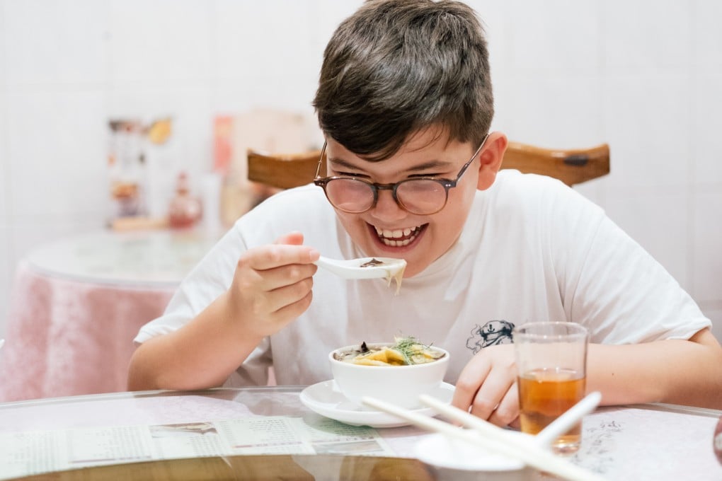 Gustav, a tourist from Germany, tucks into snake soup at Ser Wong Fun in Hong Kong. Photo: Sarah Kohler