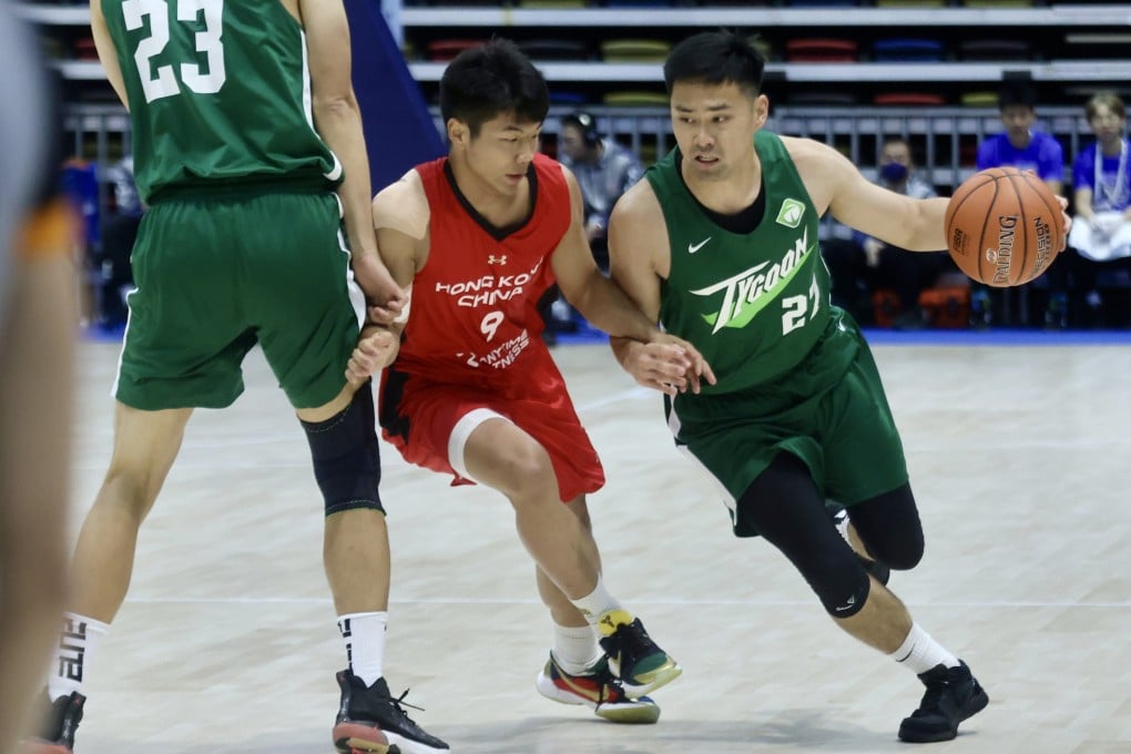 Hong Kong’s Chung Chi-wing (left) defending against Tycoon’s Tsai Choi-kwan at the National Games test event at Hong Kong Coliseum in April. Photo: Jonathan Wong