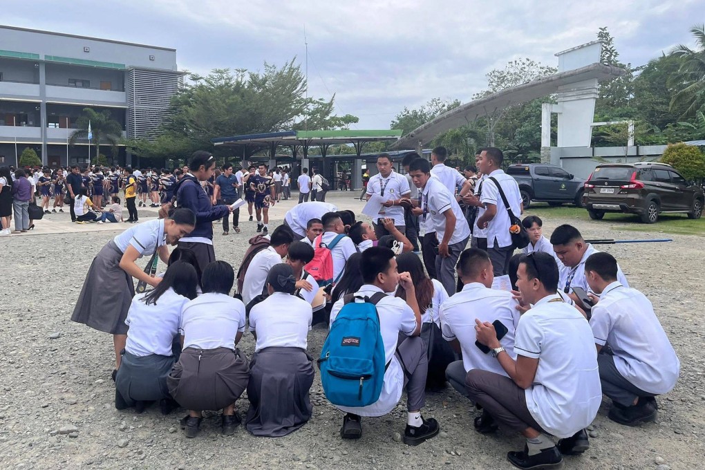 Students gather outside a school building after an earthquake in Davao de Oro, Mindanao, Philippines on Friday. Photo: Golden Cornucopia-Davao de Oro State College/AFP