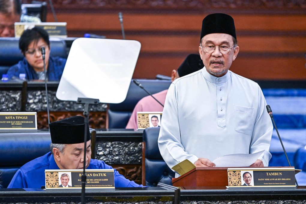 Malaysia’s Prime Minister and Finance Minister Anwar Ibrahim delivers his speech on the 2026 national budget in parliament on Friday. Photo: Malaysia’s Department of Information/AFP
