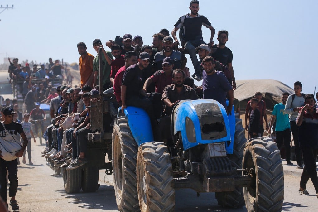 Palestinians make their way towards Gaza City from Nuseirat in the central Gaza Strip on Friday. Photo: AFP