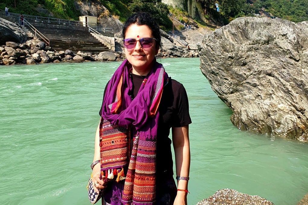 Aarti Pathak stands by the Ganges river in Rishikesh, a northern Indian city regarded as a centre for yoga, following the conclusion of her treatment for breast cancer. The Mumbai mother shares how traditional medicine and the love of her family helped her survive the disease. Photo: Aarti Pathak
