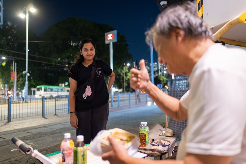 Bianca Sadhwani gets a thumbs up from an elderly resident during a Hanuman Charity outreach session. Photo: Kong Yat-pang