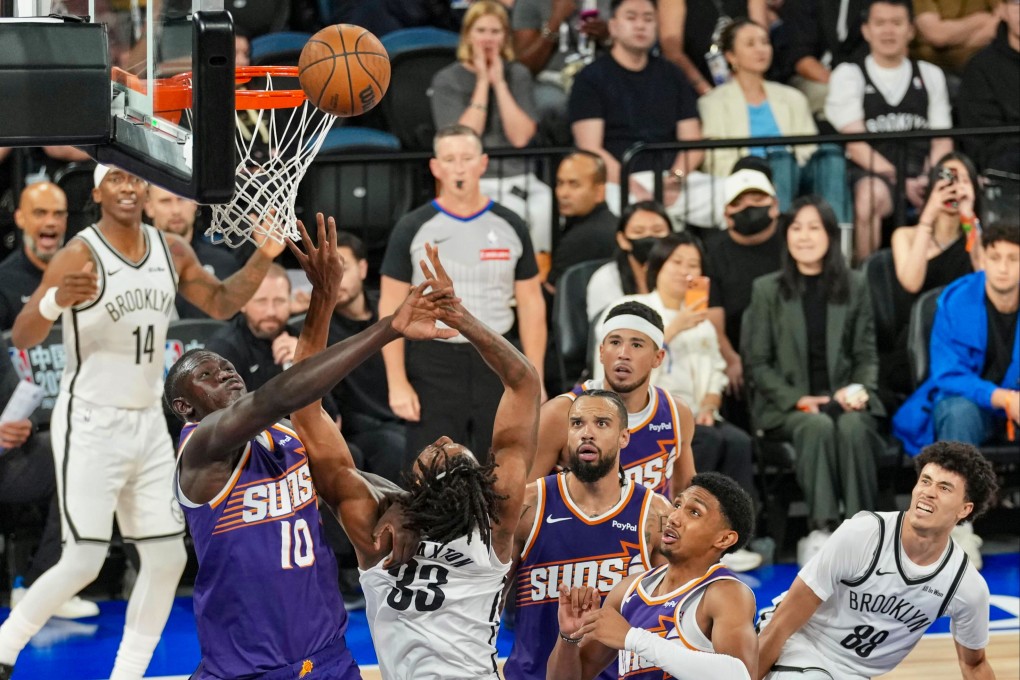 Phoenix Suns’ Khaman Maluach (left) jostling with Brooklyn Nets’ Nic Claxton under the net in their match at the The Venetian Arena, Macau. Photo: Karma Lo