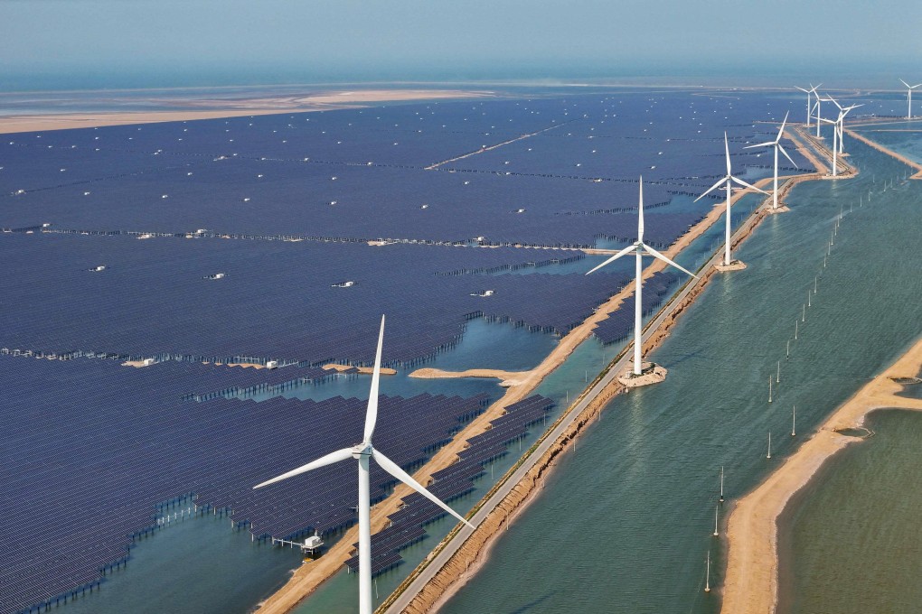 Solar panels and wind turbines are seen at the Huaneng Binzhou new energy power generation project in Binzhou, in China’s eastern Shandong province, on June 11, 2025. Photo: AFP