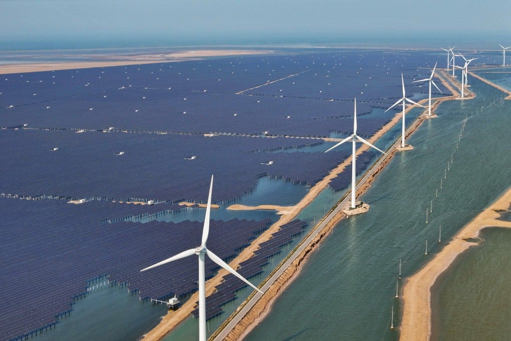 Solar panels and wind turbines are seen at the Huaneng Binzhou new energy power generation project in Binzhou, in China’s eastern Shandong province, on June 11, 2025. Photo: AFP