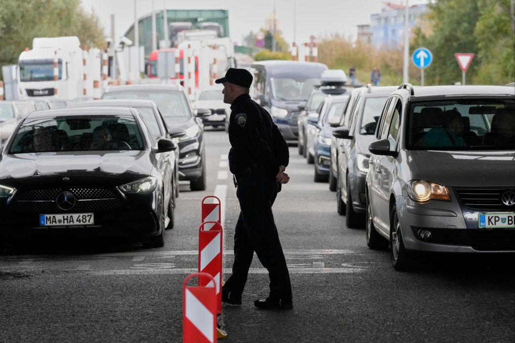 Motorists wait to enter Croatia on Sunday at a border crossing between Croatia and Bosnia and Herzegovina, as a new system begins that requires all non-EU citizens to register their personal details when they first enter the Schengen area. Photo: AP