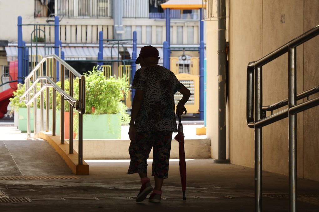 An elderly person walks through Oi Man Estate in Ho Man Tin on October 10. Social welfare authorities have pledged to improve their services for carers by removing unnecessary checks on their background and medical history, adding that any care homes failing to do it would receive a warning. Photo: Jelly Tse