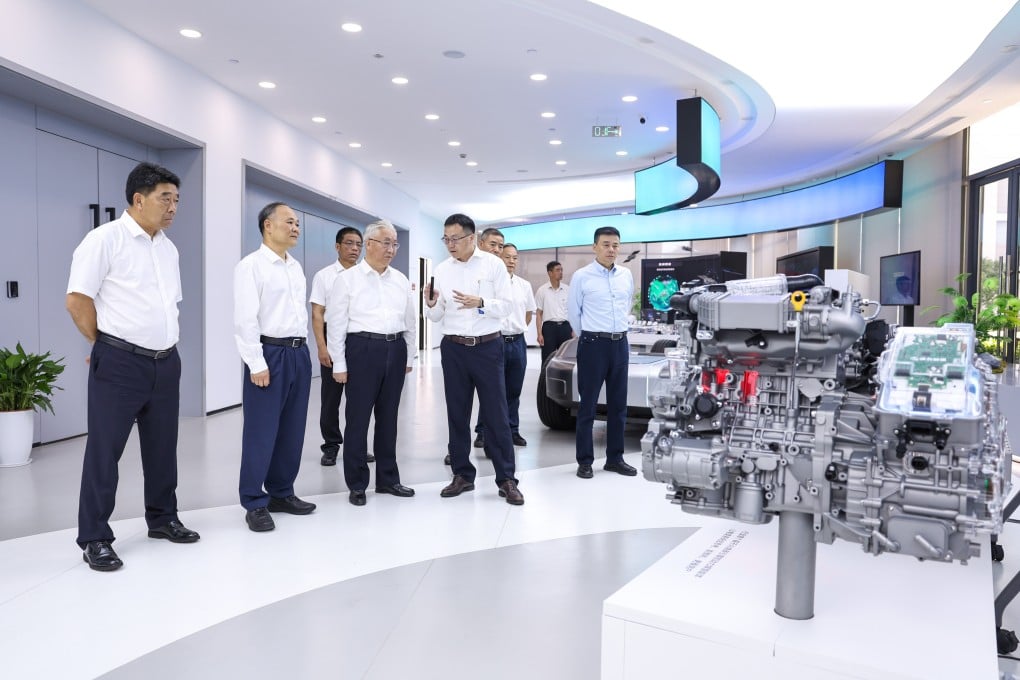 Vice-Premier Zhang Guoqing (third from left) visits an enterprise manufacturing all-solid-state batteries for new energy vehicles, in Zhejiang province on Friday. Photo: Xinhua