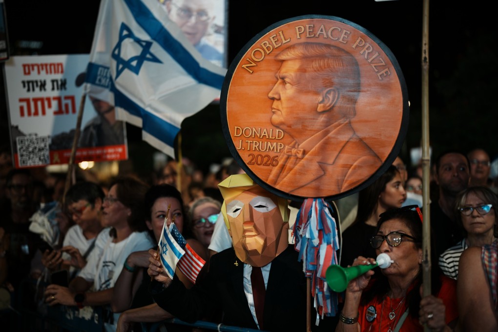 A man wearing a mask resembling US President Donald Trump during a rally in support of hostages held by Hamas, at Hostages Square in Tel Aviv, Israel, on Saturday. Photo: AP