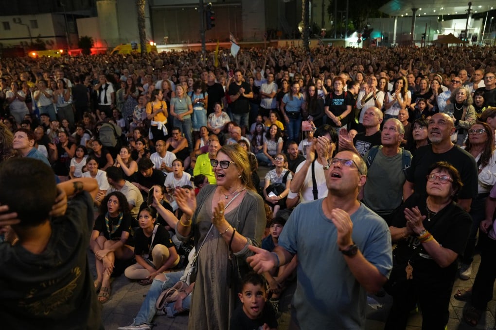 People at a rally in support of hostages kidnapped by Hamas, at a plaza known as hostages square, in Tel Aviv, Israel, Saturday, ahead of the expected release of the hostages held in the Gaza Strip. Photo: AP