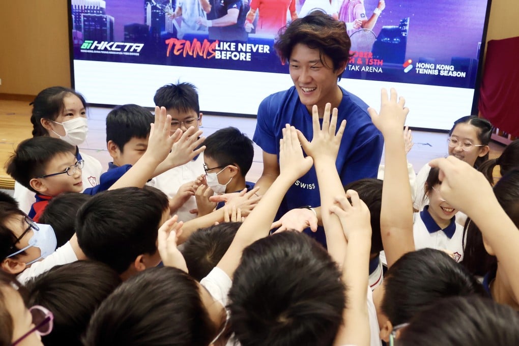 Tennis star Zhang Zhizhen meets pupils at S.K.H. St. Michael’s Primary School on Monday. Photo: Jonathan Wong
