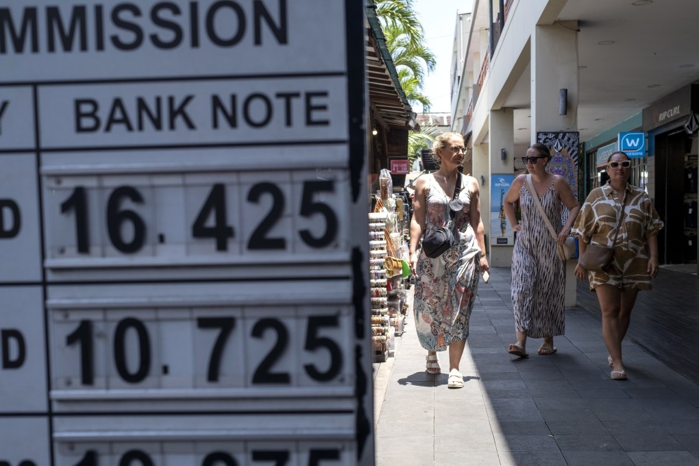 Tourists explore a shopping area in Seminyak on the west coast of Bali. Photo: EPA