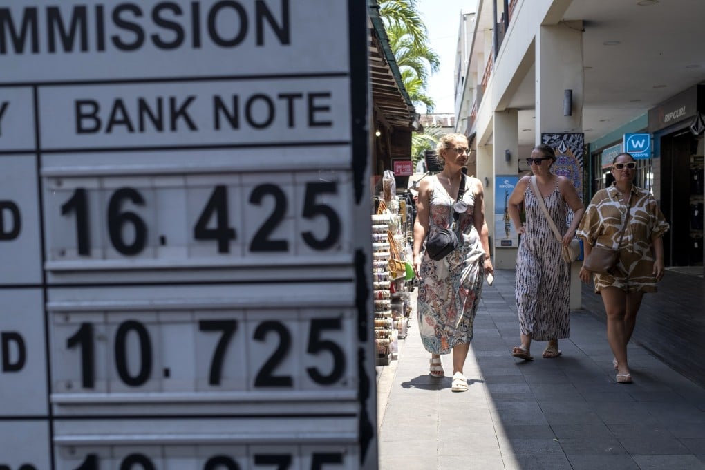 Tourists explore a shopping area in Seminyak on the west coast of Bali. Photo: EPA